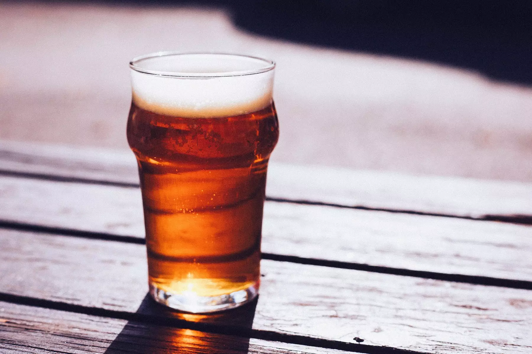 Glass of beer on table